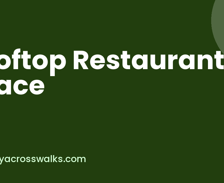 Rooftop restaurant space in Greater Noida with string lights at dusk